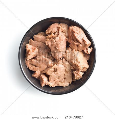 Cod liver in oil on plate isolated on white background.