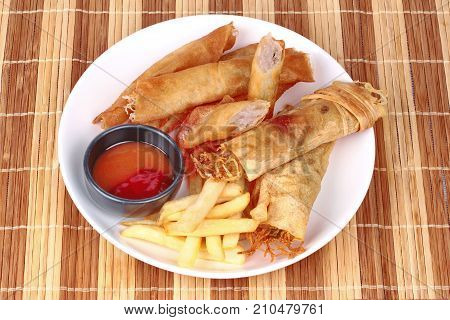 Deep Fried Spring Roll,and Frence Fries Sreved With Tomato Souce And Chili Sauce.