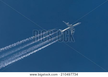 Large four engine plane at cruising altitude