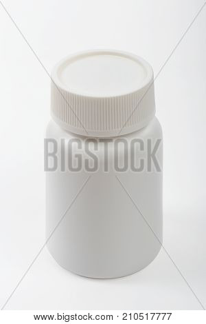 Medicine white pill plastic bottle isolated on white background clipping path.