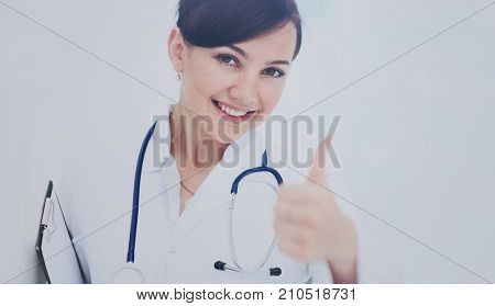 A female doctor shows a sign okay