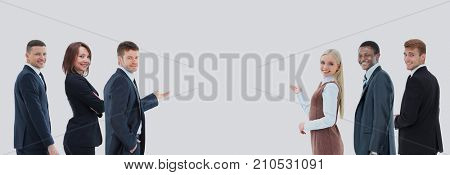 Portrait of happy smiling young business people showing blank ar