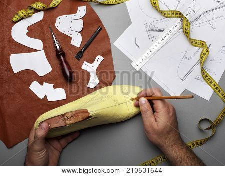 Modelling Design Of A Shoes.workplace Of Shoe Designer.hands Of Designer Draw A Shoe Design .copy Sp
