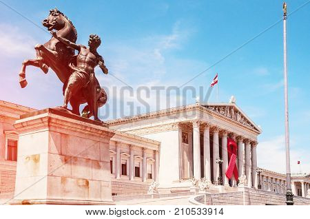 Vienna Austria. Austrian parliament building in front of parliament Bronze horse tamer (Rossbändiger).