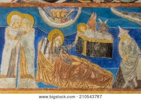 Mary visits Elisabeth. The birth in the stable Christmas fresco in a medieval church. Bjaresjo Sweden September 4 2014