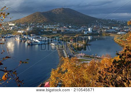 Kamchatka city landscape: autumn view of Petropavlovsk-Kamchatsky City and seaport on shore of Avachinskaya Bay (Avacha Bay) in Pacific Ocean. Kamchatka Region Russian Far East Eurasia.