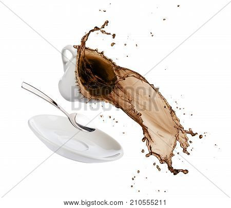 cup of coffee spils with saucer spoon and coffee falls on white background