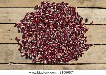 Closeup image of red white haricot kidney beans background  on wood