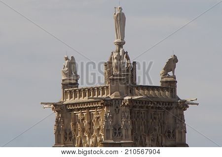 The tower Saint Jacques - Paris, France. The tower Saint Jacques is an isolated tower, built between 1509 and 1523, raised (drawn up) in the middle of the first Parisian public garden, which bears its name, in 4 District of Paris.