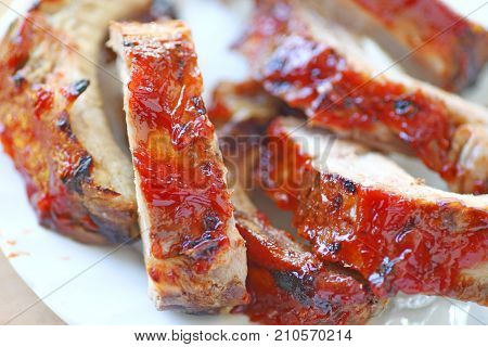 Closeup Of Oven-barbecued Baby Back Ribs Glazed With A Ketchup-based Sauce