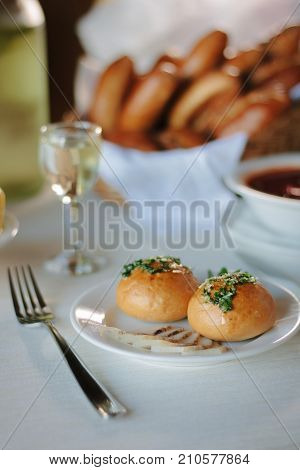 Ukarnian food - round pastries pampushki on ceramic plate