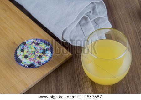 Tasty cupcakes on a white wooden table