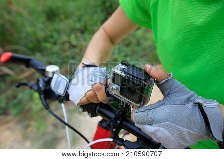 closeup of action camera mounted on mountain bike