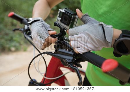 closeup of action camera mounted on mountain bike