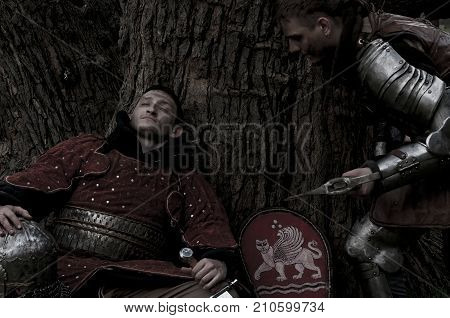 One soldier sleeping and the other sneaks to him