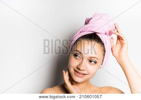 the girl after the shower coquettishly looks away, isolated