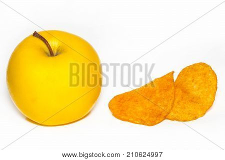 Potato Chips And An Apple,the Concept Of Choosing The Right Food, Isolated On White Background