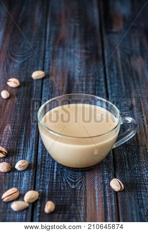 Coffee With Milk And Pistachios On The Table, Copy Space