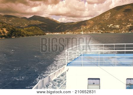 View of the Greek port of Nidri from the ship. Coast of the island of Lefkada at sunset. Greek island Lefkada in the Ionian Sea