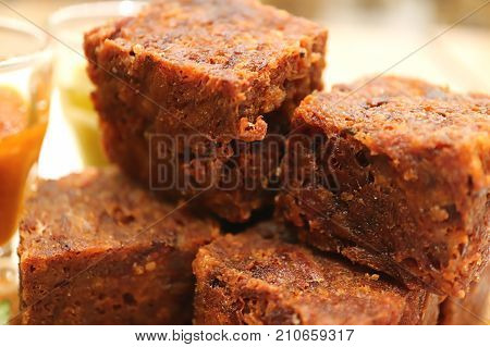 Closed up texture of deep fried crispy minced pork cubes, with selective focus