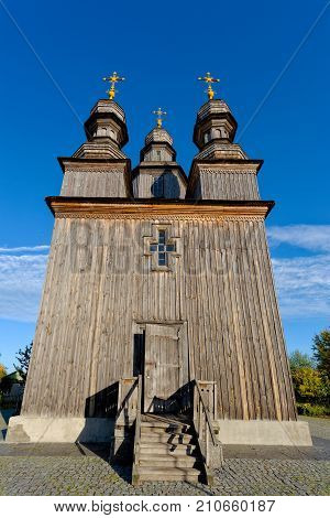 Old wooden church, standing in the autumn park Ukraine