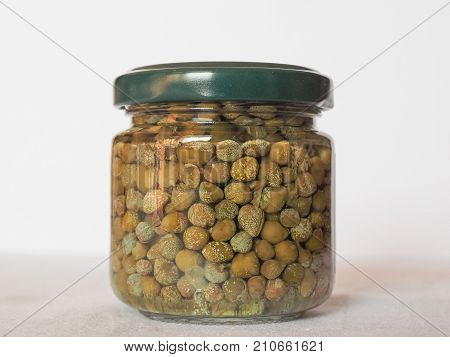 green caper (Capparis spinosa) fruit vegetarian salted food in a jar