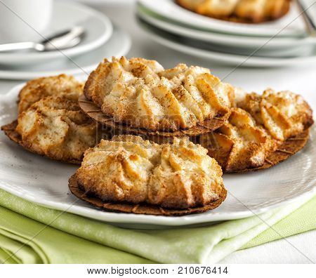 Homemade almond cookies served on a white plate.