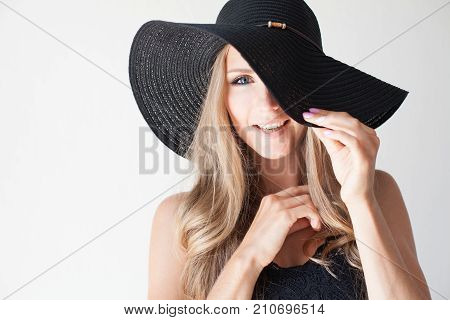 Fashionable Girl In A Hat With A Brim Poses For Advertising