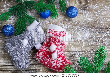 Christmas Stockings Pair On Snowbound Wooden Background, Blue Balls Ornaments