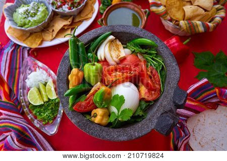 Molcajete with chili for chile ranchera sauce from Mexico