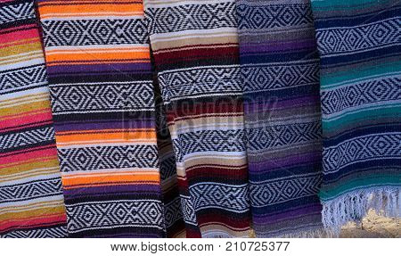 Mexican serape blanket in a row at Mexico outdoor shop