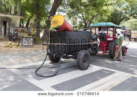 PONDICHERY PUDUCHERY INDIA - SEPTEMBER 05 2017. Unidentified workers works on a road construction industry and teamwork