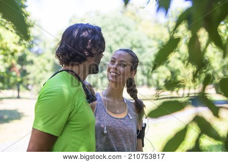 Smiling Couple Stretching Outdoors