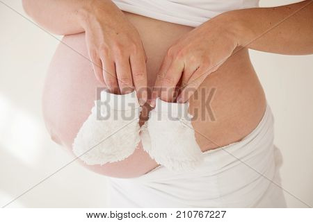 The Stomach Of A Pregnant Woman And Baby Stuff Socks