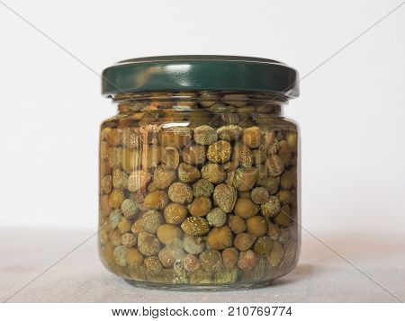 green caper (Capparis spinosa) fruit vegetarian salted food in a jar