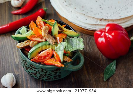Vegetarian variant of mexican fachitos on wooden board.