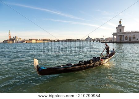 Venice Italy - June 18 2016: Gondola On Canal Grande In Venice In A Beautiful Summer Day In Italy On