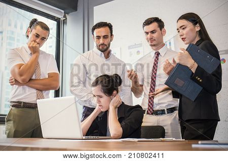 Stressful Business Young Woman With Her Hands On Her Head In Front Of Her Laptop. Business Team Stre