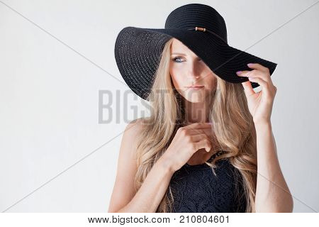 Fashionable Girl In A Hat With A Brim Poses For Advertising 1