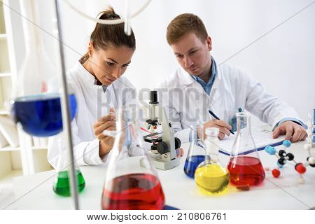 Two Stunents Practice At Schoold Laboratory