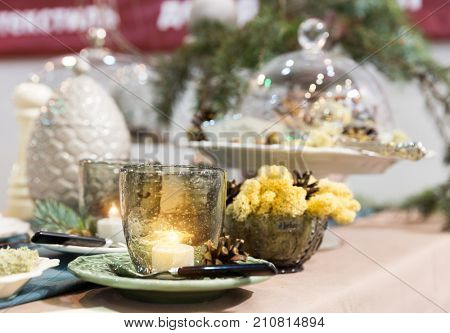 Chrictmas table with pinecones and candles