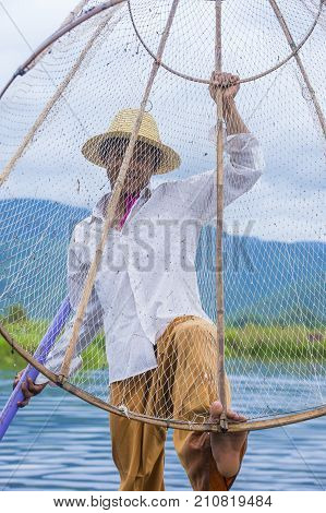 INLE LAKE MYANMAR - SEP 07 : Burmese fisherman at Inle lake Myanmar on September 07 2017 inle Lake is a freshwater lake located in Shan state