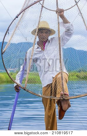 INLE LAKE MYANMAR - SEP 07 : Burmese fisherman at Inle lake Myanmar on September 07 2017 inle Lake is a freshwater lake located in Shan state