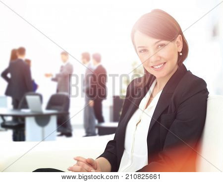Beautiful business woman with co-wokers at background