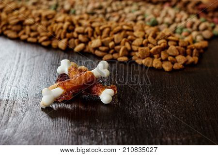 Calcium bones for dog feeding on wooden background