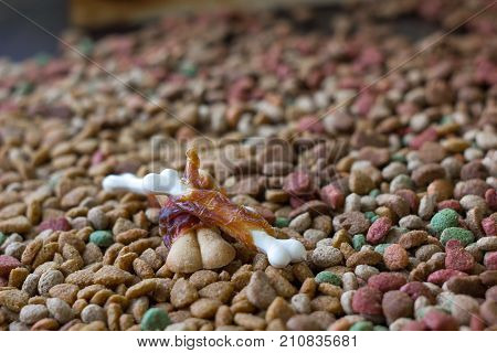 Calcium bones for dog feeding on hip of dry pet food