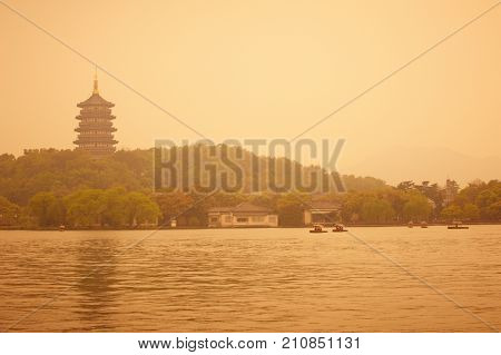 beautiful hangzhou west lake scenery, leifeng pagoda at sunset.