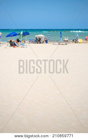 White Beaches Italy. Sea Sky People Umbrellas Sun Beds.
