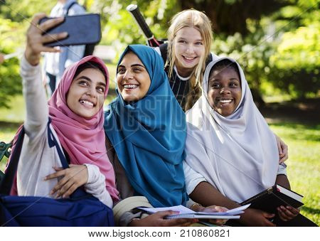 Group of students using mobile phone