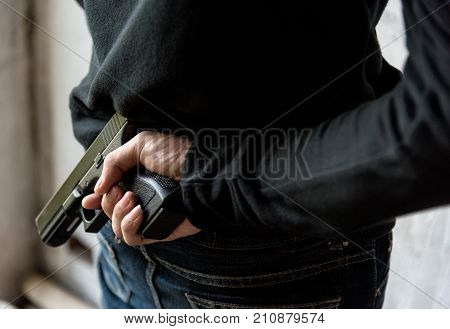 Man Hid Gun Behind Their Back